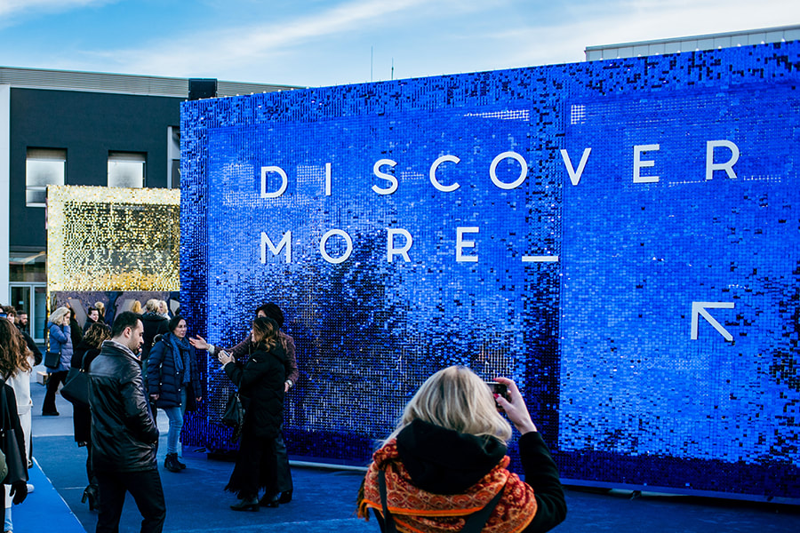 A blue sequin wall display at the VicenzaOro trade show in Vicenza, Italy.