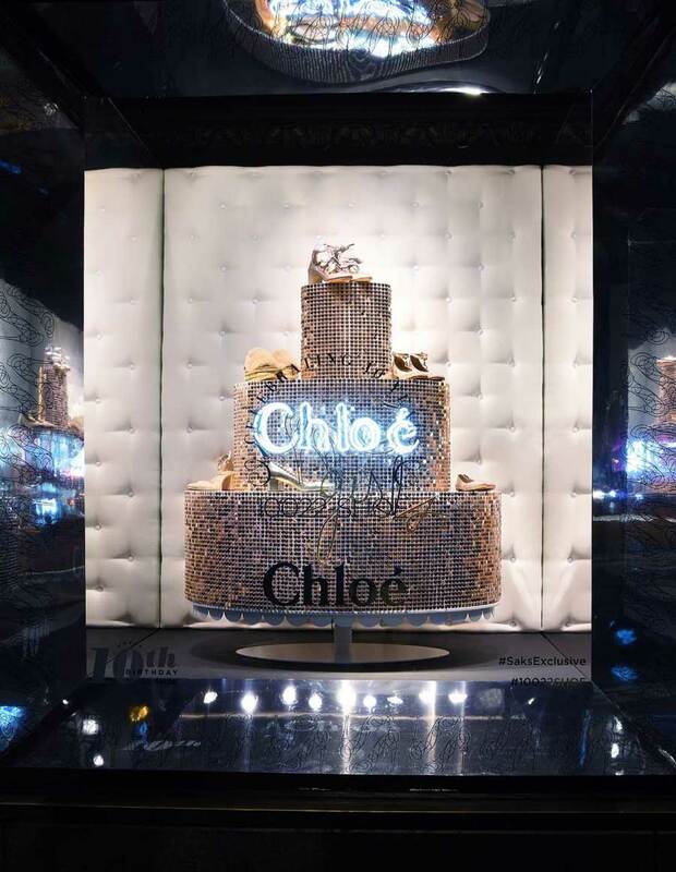 Sparkle cake with curved shimmer sequin wall panel for fashion visual merchandising idea