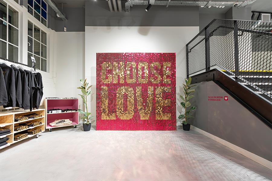 Red sequin wall for Choose Love shop decoration.