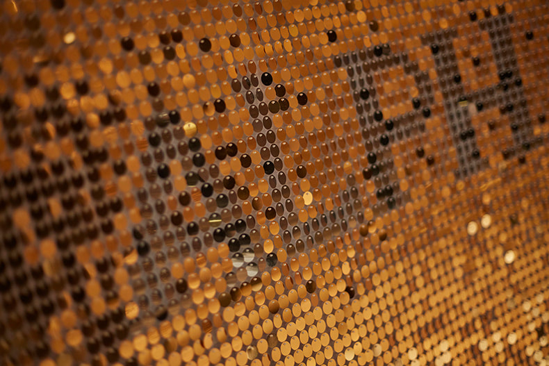 A close-up image of the Shimmerwall sequin panels populated with gold sequins.