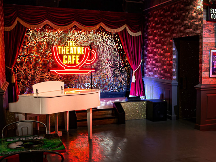 A stage set design with a shimmerwall in the background.