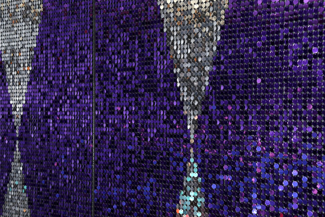Large decorative sequin wall using purple and silver sequins in 15mm format for corporate VIP area in Germany.