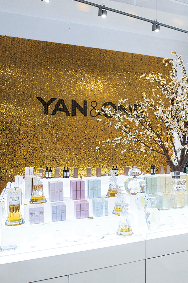bright and shimmering sequin backdrop for cosmetics chain.